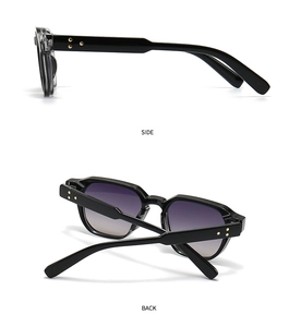 Detail of black sunglasses featuring golden star rivets on the side and back views