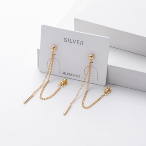 Detailed close-up of long gold tassel S925 sterling silver earrings on jewelry card