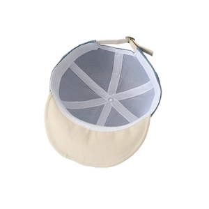 Kids baseball cap with blue and beige patchwork, featuring breathable mesh lining