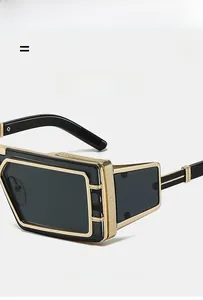 Detail of retro sunglasses showing the premium gold metal hinge and embossed temple design