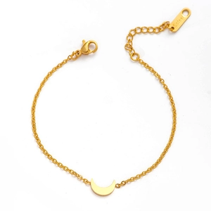 Gold layered stainless steel bracelet set with crescent moon charms on white background