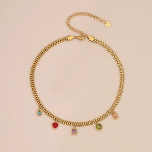 Detailed shot of golden stainless steel chain with colorful gemstone heart pendants