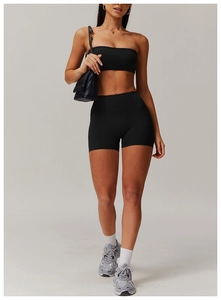 Three-piece black yoga set with high-waist shorts and sports bra for fitness styling