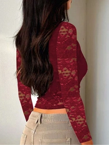 Detail of burgundy long sleeve top with transparent lace patchwork sleeves and slim fit design