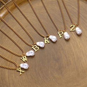 Elegant gold Cuban chain necklace with initial letters and baroque pearl pendants