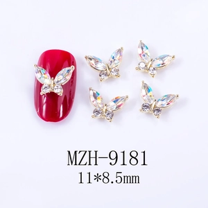 Macro shot of 11x8.5mm aurora butterfly nail charms with gold metal and crystals