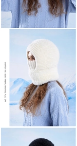 Detail of white winter knitted balaclava with warm plush lining and face cover design