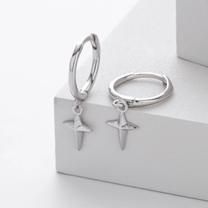 Detailed close-up of S925 sterling silver hoop earrings with four-pointed star charms