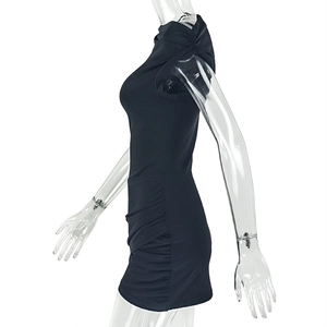 Detail view of black bodycon dress with side ruching and gathered shoulder accents