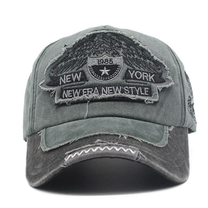 Detail of vintage charcoal grey washed cotton baseball cap with 1985 embroidery