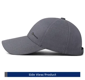 Side view of grey baseball cap featuring HEROISM letter and shield logo embroidery