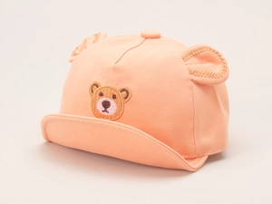 Detailed close-up of orange-pink baby baseball cap with soft brim and 3D bear ears