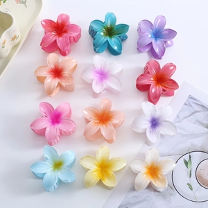 Detailed grid view showing plumeria flower hair claws in colorful gradient shades
