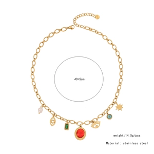 Flat lay of gold cat-eye heart necklace with multiple charms and measurement details