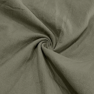 Macro texture view of olive green linen fabric showing woven details and draping