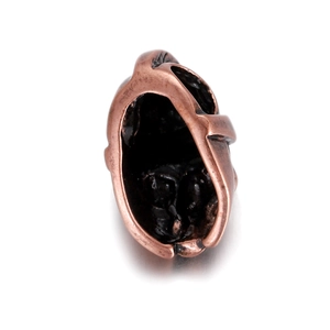 Detailed view of an 18K gold plated copper skull helmet pendant bead for DIY jewelry