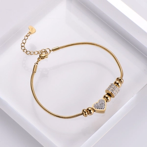 Polished gold stainless steel heart charm bracelet with sparkling white zircon stones
