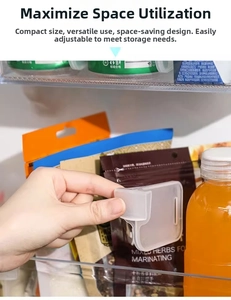 Detail of adjustable snap-on refrigerator dividers for shelf organizing in clear finish