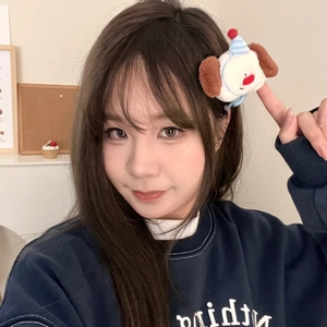 Cute plush puppy hair clip worn on model hair side, perfect for girls' casual styling