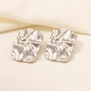 Detailed view of silver 304 stainless steel rectangular earrings with a wrinkled texture