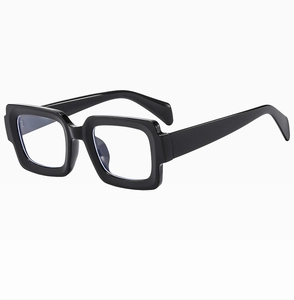 Detail view of the black thick square frames and polished temple design of these sunglasses