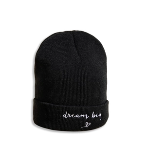 Detail view of black knit beanie with white dream big text and heart embroidery