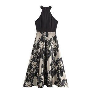 Elegant sleeveless halter dress with black bodice and floral champagne A-line skirt