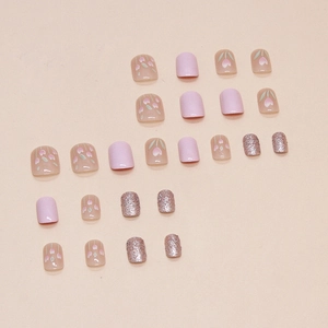 Short square press-on nails with purple tulip art and rose gold glitter design