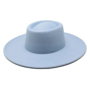 Detailed close-up of light blue wool felt pork pie hat with a wide flat brim and concave crown