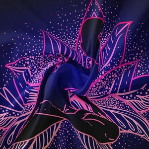 Macro detail of bohemian tapestry showing silky blue fabric with pink lotus pattern