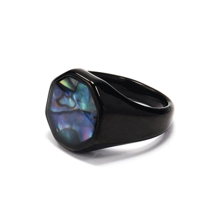 Detailed view of an octagonal titanium ring with black finish and abalone shell inlay