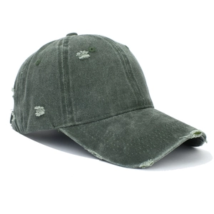 Distressed washed cotton baseball cap in dark green featuring vintage ripped detailing
