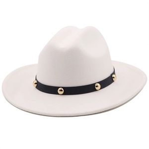 Detail of cream felt fedora hat featuring black band with gold metal studs accents