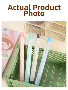 Detail of four macaron-colored retractable erasers in a green organizer bin