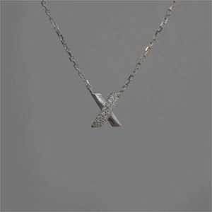 Minimalist 925 sterling silver X-shaped cross necklace featuring sparkling zircon accents