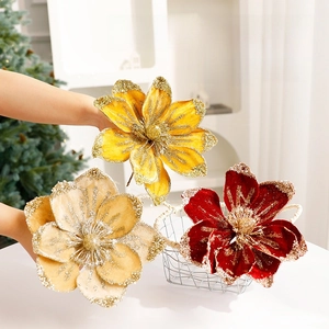 Artificial Christmas magnolia flowers in red and gold with glitter for tree decoration