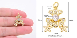 Guide des dimensions d'un pendentif fleur marguerite dorée serti de pierres zircon