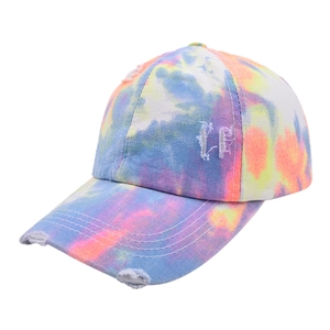 Tie-dye cross ponytail baseball cap with distressed details and sun protection peak