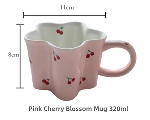 Detailed view of pink flower-shaped ceramic mug with cherry patterns and size specs