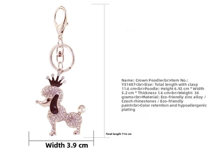 Detailed macro view of the sparkling rhinestone puppy keychain with black crown accents