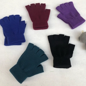Flat lay of five thick knitted fingerless gloves in blue, burgundy, purple, teal, and black