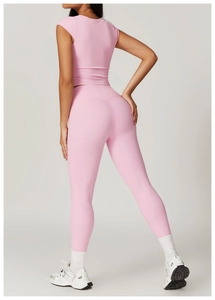 Close-up of pink yoga set showing high waist leggings with butt lifting effect