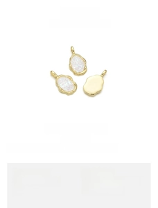 Detailed size view of irregular gold-plated copper pendant with white opal stone