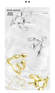 Detail view showing S925 hallmark on irregular liquid metal silver and gold rings
