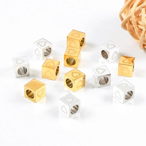 Polished stainless steel cube beads with heart pattern in gold and silver finishes