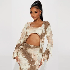 Women's two-piece tie-dye set featuring a bandage crop top and matching fringe maxi skirt