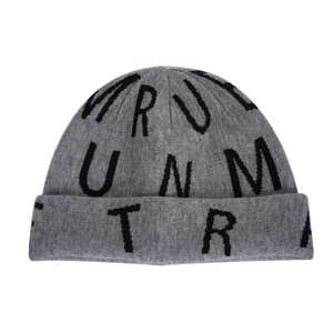 Detailed macro view of grey knit beanie with black woven RUNMTR letters and cuff design