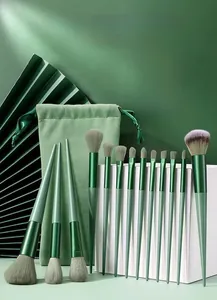 Detail of 13-piece matcha green makeup brush set with soft fiber bristles and storage bag