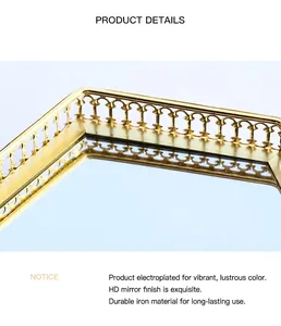 Close-up of golden hollow metal frame and high-definition mirror base on the tray