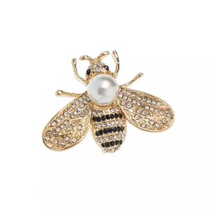 Elegant gold bee brooch with white pearl, black enamel and sparkling crystal rhinestones